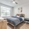 Secondary bedroom with a bed and a fan
